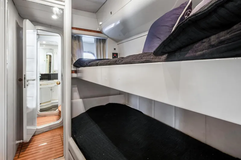 Slide: The Image of Interior of a 1998 Baia Sports Cruiser with bunk beds. - 24