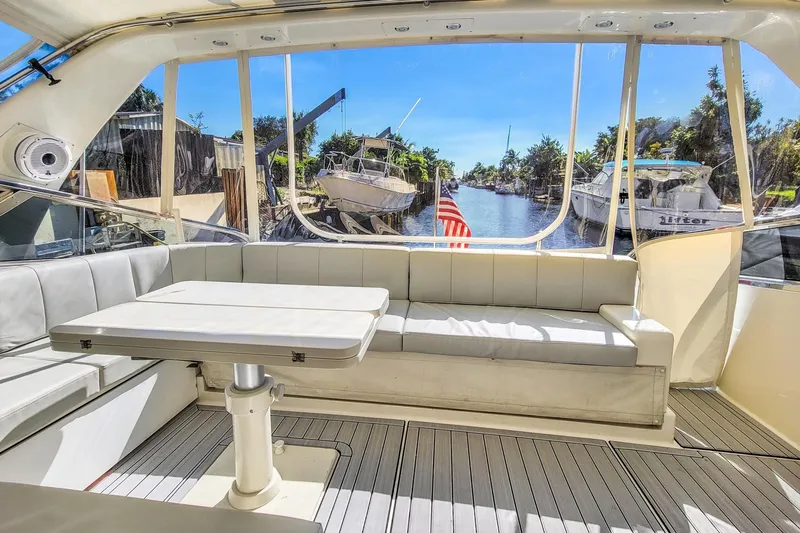 Slide: The Image of Interior of a 1998 Baia Sports Cruiser with seating area and table. - 9