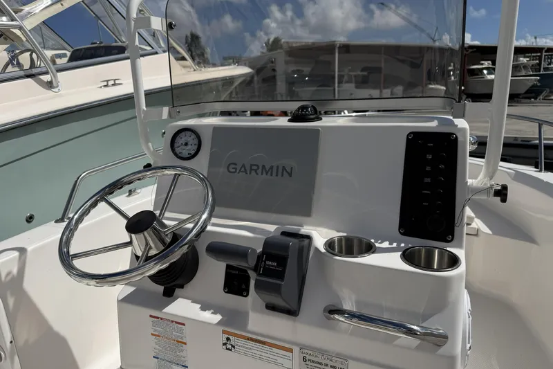Slide: The Image of 2017 Robalo R160 Center Console boat dashboard with Garmin navigation system. - 6
