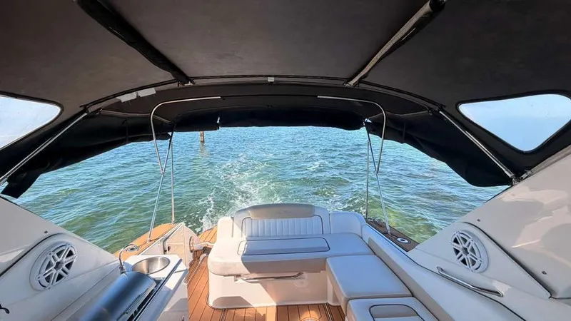Slide: The Image of Interior view of a 2010 Sea Ray Sundancer 310 on the water. - 12