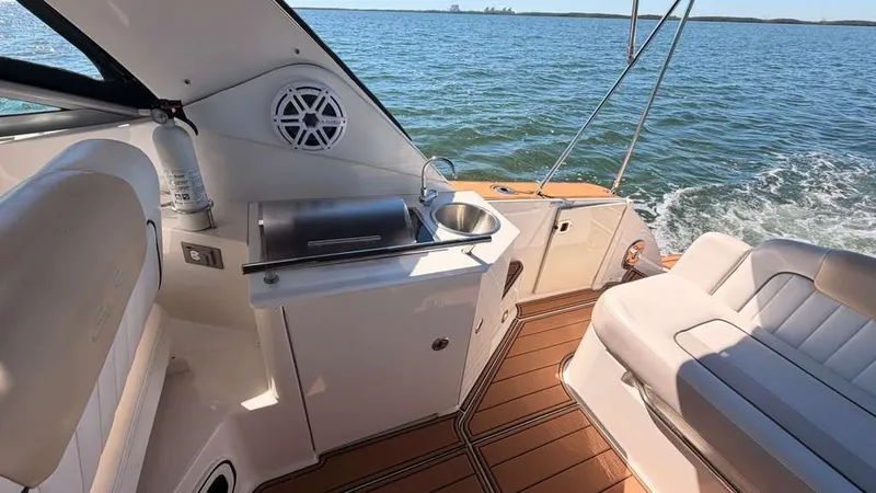 Slide: The Image of Interior of a 2010 Sea Ray Sundancer 310 on the water. - 14
