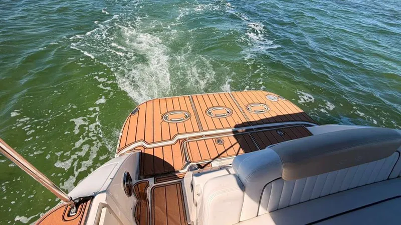 Slide: The Image of Rear view of Sea Ray Sundancer 310 yacht on the water. - 15