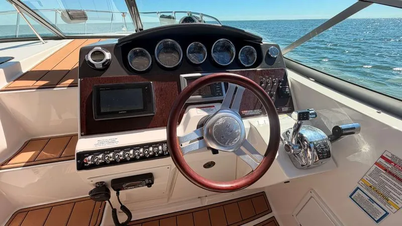 Slide: The Image of Sea Ray Sundancer 310 helm, 2010 model, on open water. - 19