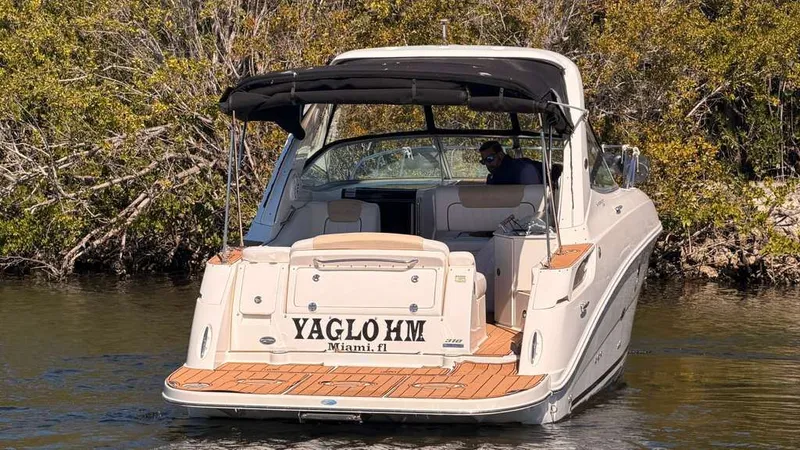 Slide: The Image of 2010 Sea Ray Sundancer 310 boat on calm water. - 4