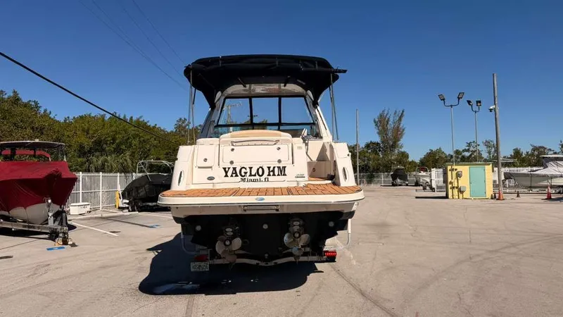 Slide: The Image of 2010 Sea Ray Sundancer 310 boat in a parking lot. - 7