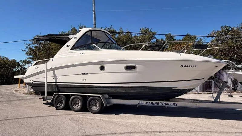 Slide: The Image of 2010 Sea Ray Sundancer 310 on a trailer, side view. - 8