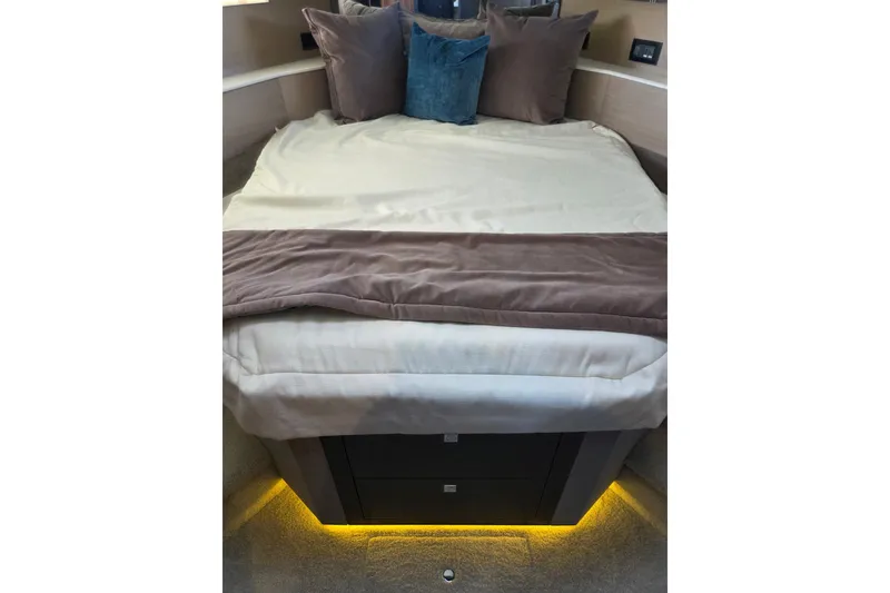 Slide: The Image of Luxurious bedroom interior of 2018 Cruisers Yachts 54 Cantius with elegant bedding and ambient lighting. - 17