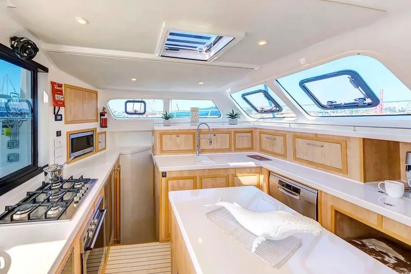 Slide: The Image of Luxurious 2021 Royal Cape Catamarans Majestic kitchen interior with modern appliances and ample natural light. - 13