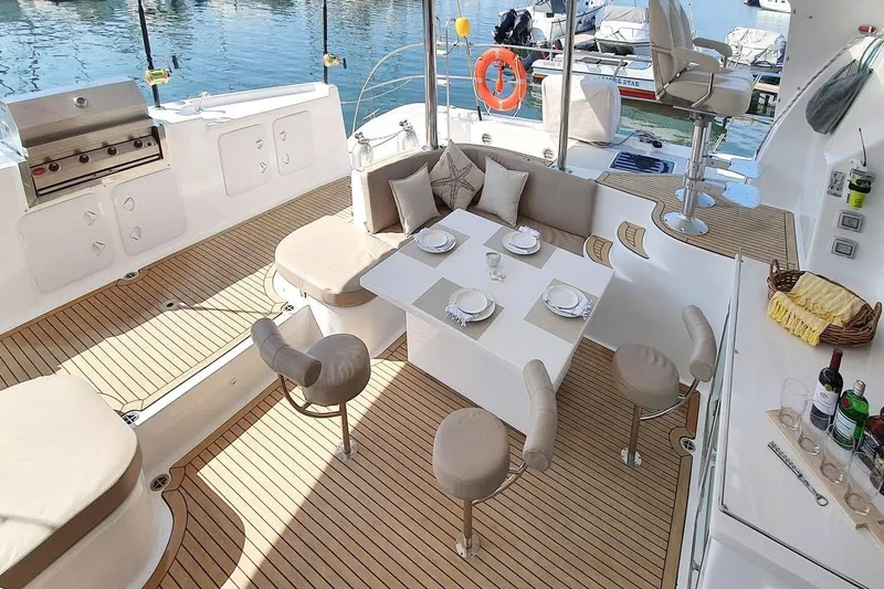 Slide: The Image of Luxurious 2021 Royal Cape Catamarans Majestic yacht interior with elegant dining area and modern amenities. - 15
