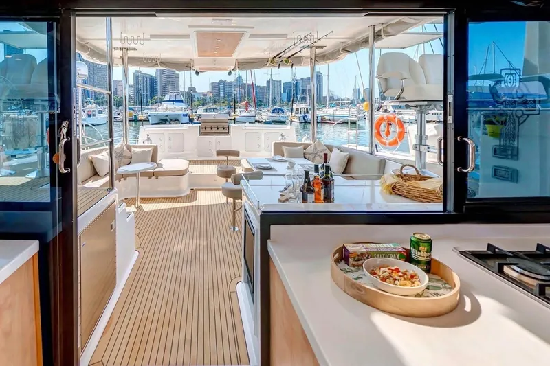 Slide: The Image of Luxurious 2021 Royal Cape Catamarans Majestic yacht interior with marina view. - 17