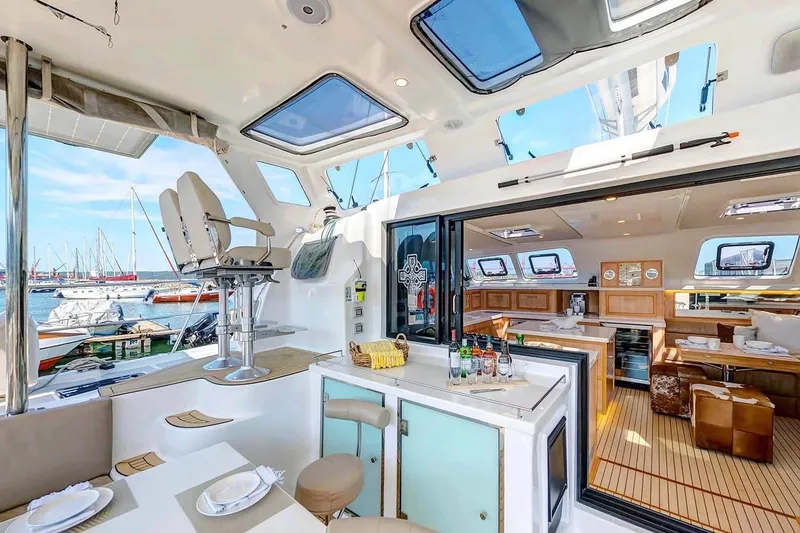 Slide: The Image of Luxurious 2021 Royal Cape Catamarans Majestic interior with elegant dining and bar area. - 18