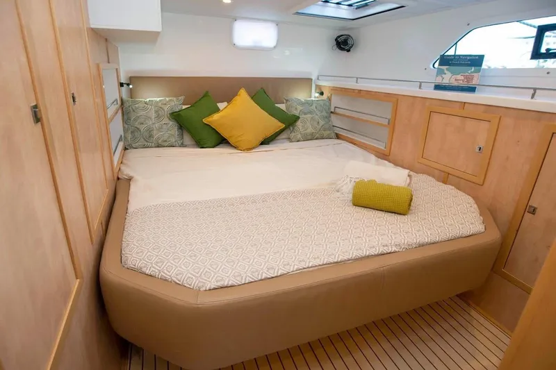Slide: The Image of Luxurious cabin interior of 2021 Royal Cape Catamarans Majestic with cozy bedding and modern design. - 21