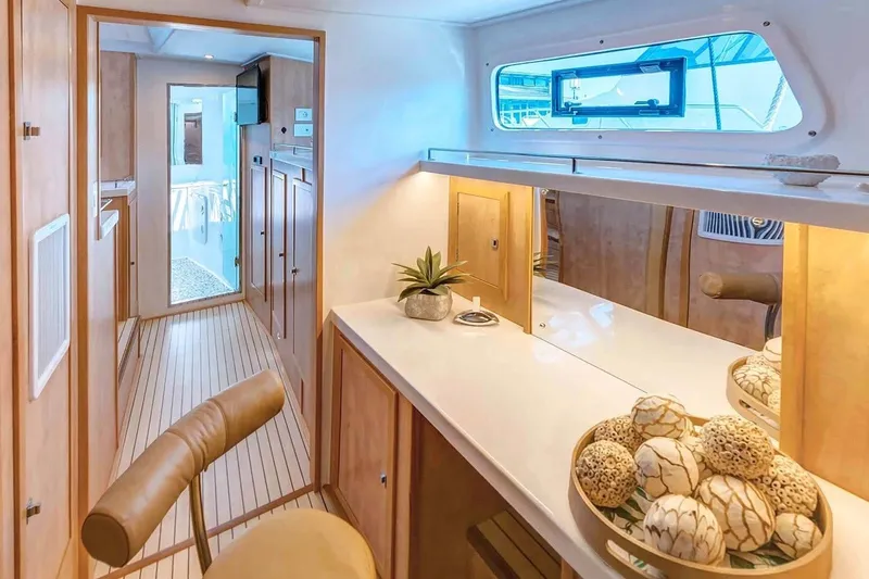 Slide: The Image of Luxurious interior of 2021 Royal Cape Catamarans Majestic, featuring elegant wood finishes and modern decor. - 25