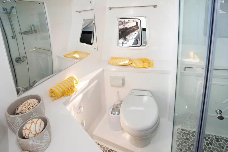 Slide: The Image of Luxurious bathroom in 2021 Royal Cape Catamarans Majestic, featuring modern fixtures and elegant design. - 27