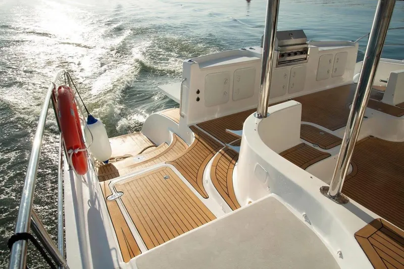 Slide: The Image of 2021 Royal Cape Catamarans Majestic deck with teak flooring and ocean view. - 29