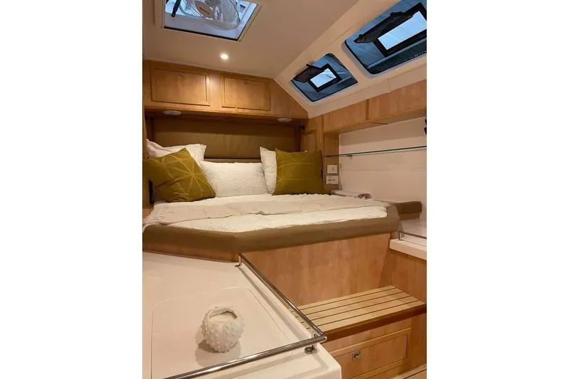 Slide: The Image of Luxurious cabin interior of 2021 Royal Cape Catamarans Majestic with cozy bedding and skylights. - 30
