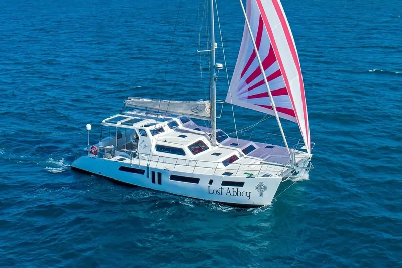 Slide: The Image of 2021 Royal Cape Catamarans Majestic sailing on open sea with vibrant sails. - 7