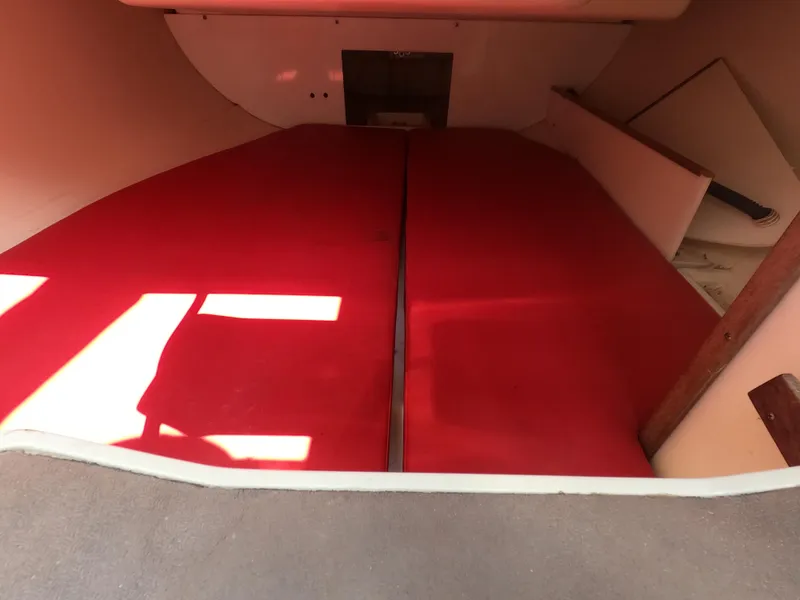 Slide: The Image of Interior of a 1998 Catalina 250 with red cushions. - 10