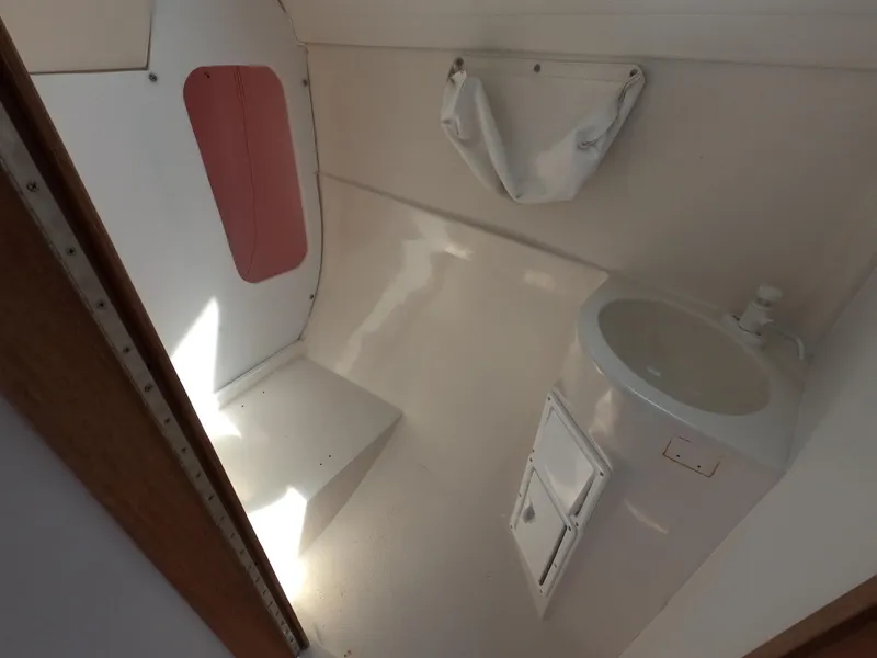 Slide: The Image of Interior of a 1998 Catalina 250 with sink and storage. - 12