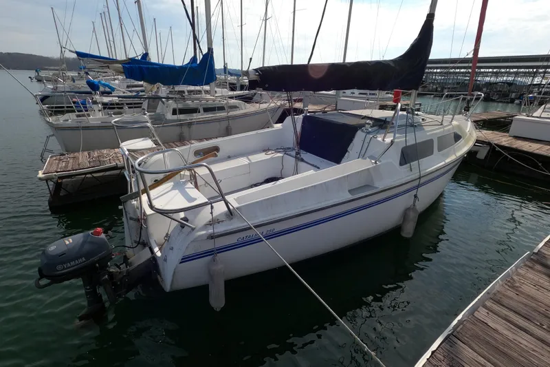 Slide: The Image of 1998 Catalina 250 sailboat docked at marina with Yamaha outboard motor. - 3