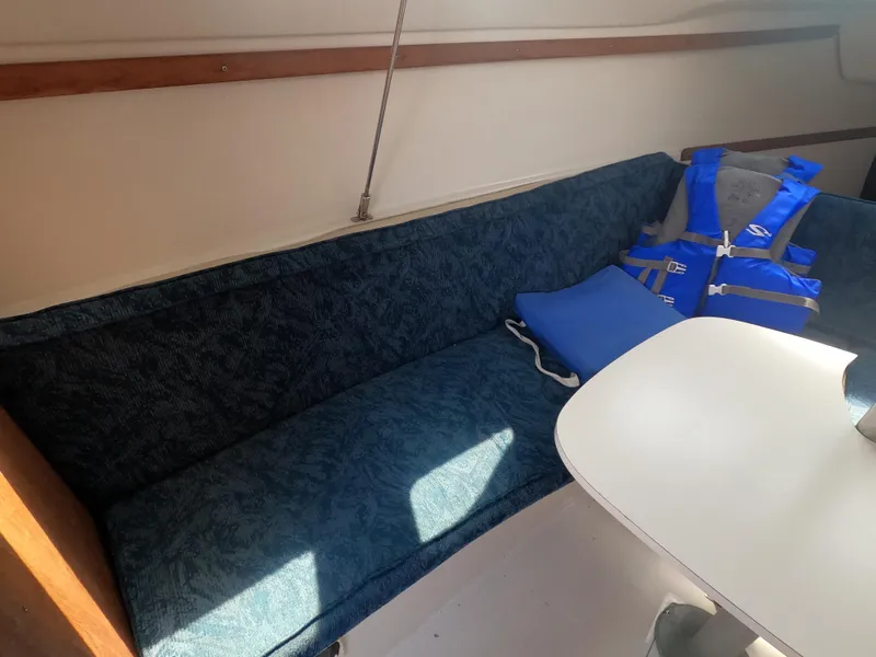 Slide: The Image of Interior of a 1998 Catalina 250 yacht with blue upholstery. - 6