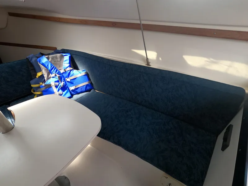 Slide: The Image of Interior of a 1998 Catalina 250 yacht with blue upholstery. - 7
