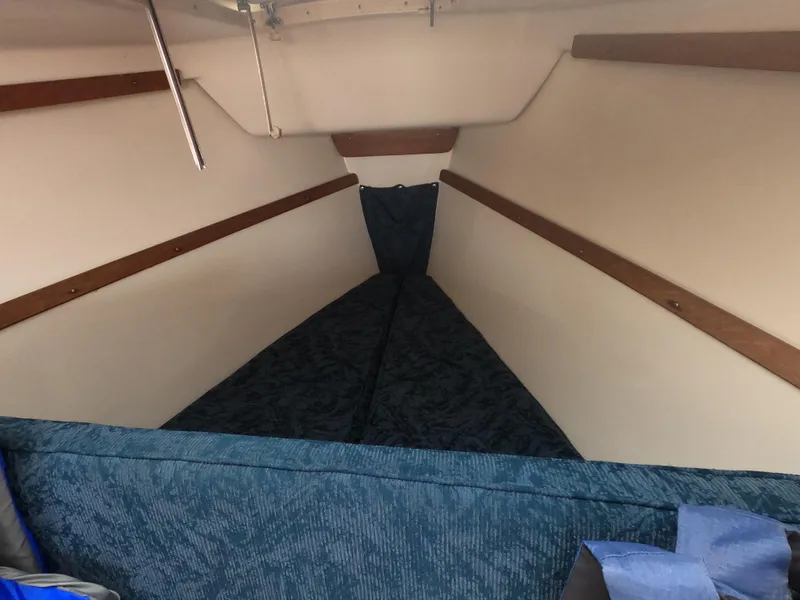 Slide: The Image of Interior of a 1998 Catalina 250 with blue upholstery. - 9