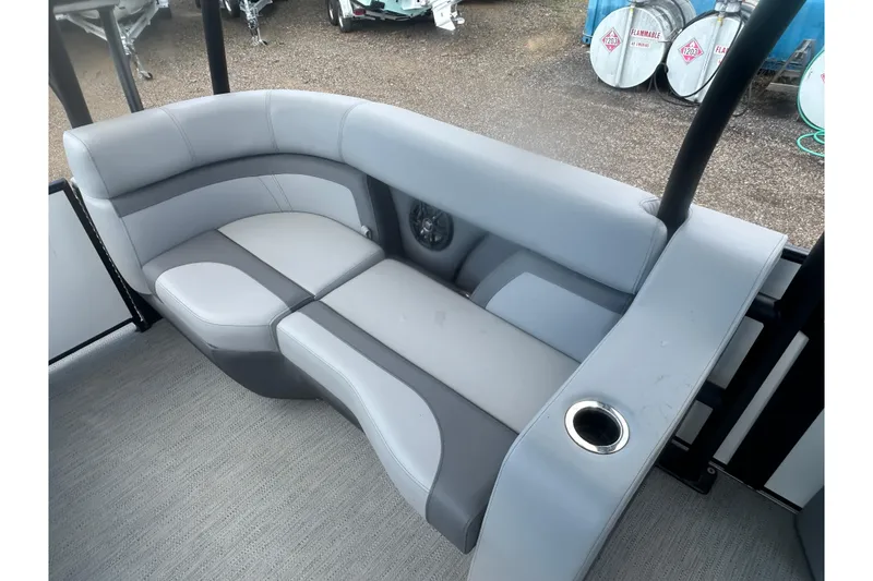 Slide: The Image of 2026 Godfrey Monaco Sun Deck 235 SDC boat with Mercury outboard motor and swim ladder. - 18