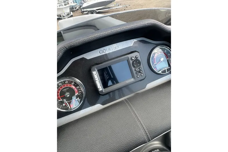 Slide: The Image of 2026 Godfrey Monaco Sun Deck 235 SDC boat seating with cup holder, gray upholstery. - 22