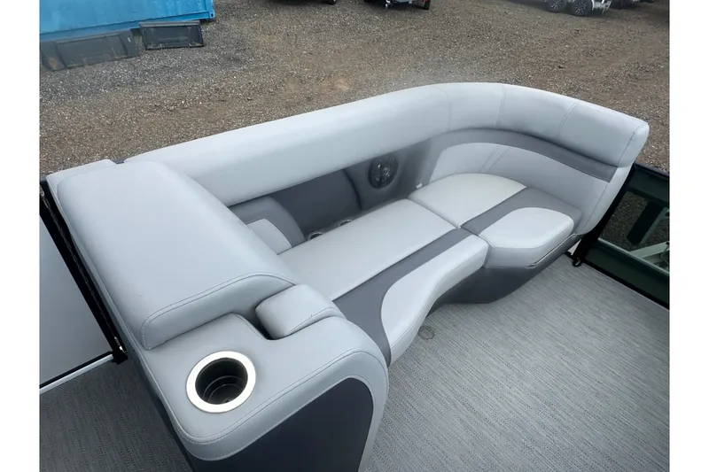 Slide: The Image of 2026 Godfrey Monaco Sun Deck 235 SDC interior with open storage compartment and seating. - 24