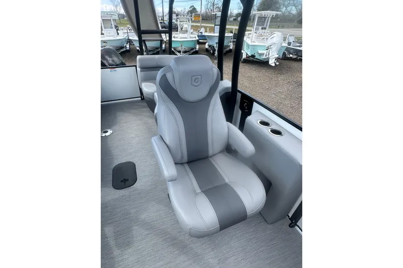 Slide: The Image of 2026 Godfrey Monaco Sun Deck 235 SDC with slide, parked among other boats. - 28