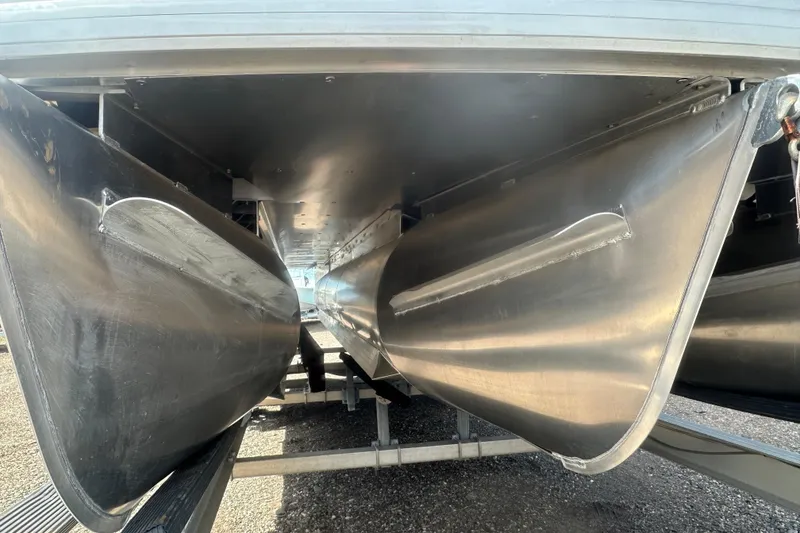 Slide: The Image of 2026 Godfrey Monaco Sun Deck 235 SDC pontoon boat on trailer, outdoor setting. - 3