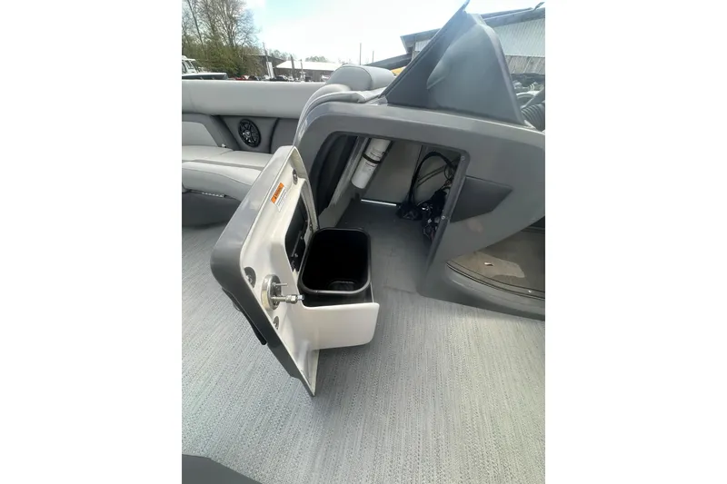 Slide: The Image of 2026 Godfrey Monaco Sun Deck 235 SDC boat interior with gray seating and cup holder. - 32