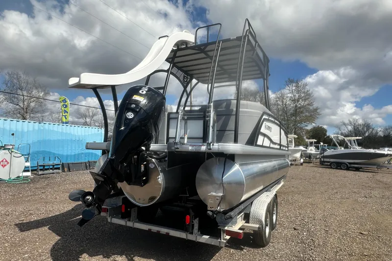 Slide: The Image of 2026 Godfrey Monaco Sun Deck 235 SDC boat with slide, parked on trailer. - 8