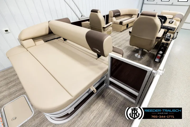 Slide: The Image of 2026 Bennington SSBSF pontoon boat interior with beige seating and modern design. - 12