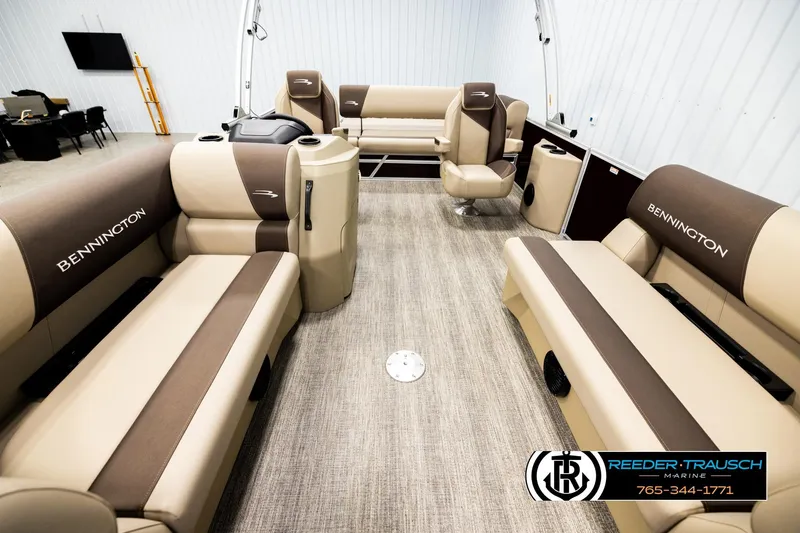 Slide: The Image of 2026 Bennington SSBSF boat interior with beige and brown seating, spacious layout. - 13