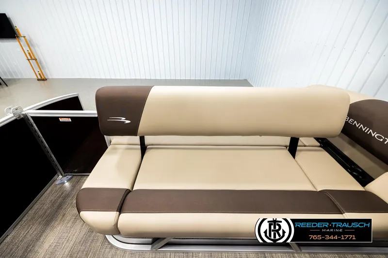 Slide: The Image of 2026 Bennington SSBSF boat seat in a showroom, featuring beige and brown upholstery. - 15
