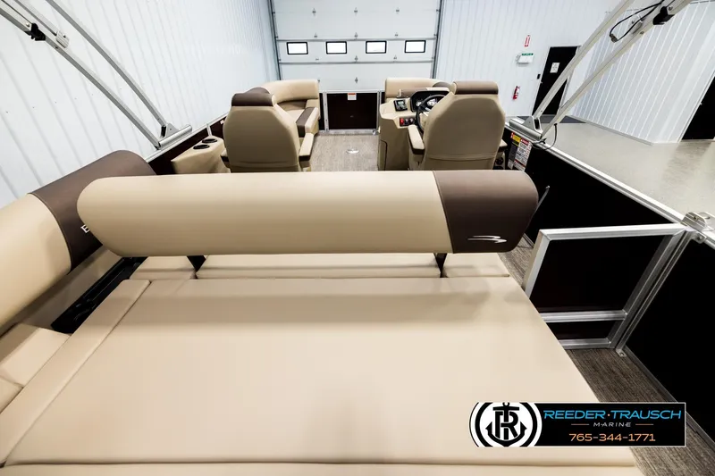 Slide: The Image of 2026 Bennington SSBSF pontoon boat interior with beige seating and modern design. - 16