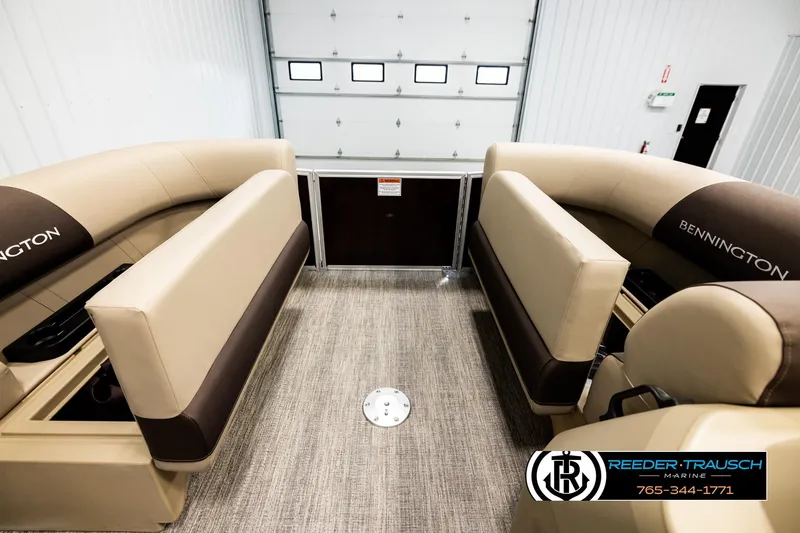 Slide: The Image of 2026 Bennington SSBSF boat interior with beige seating in a showroom. - 20