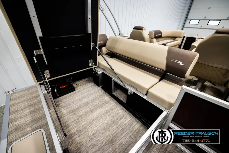 Slide: The Image of 2026 Bennington SSBSF boat interior with beige seating and storage compartments. - 25