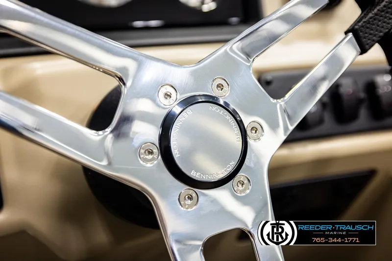 Slide: The Image of Steering wheel of 2026 Bennington SSBSF boat, featuring chrome details and branding. - 28