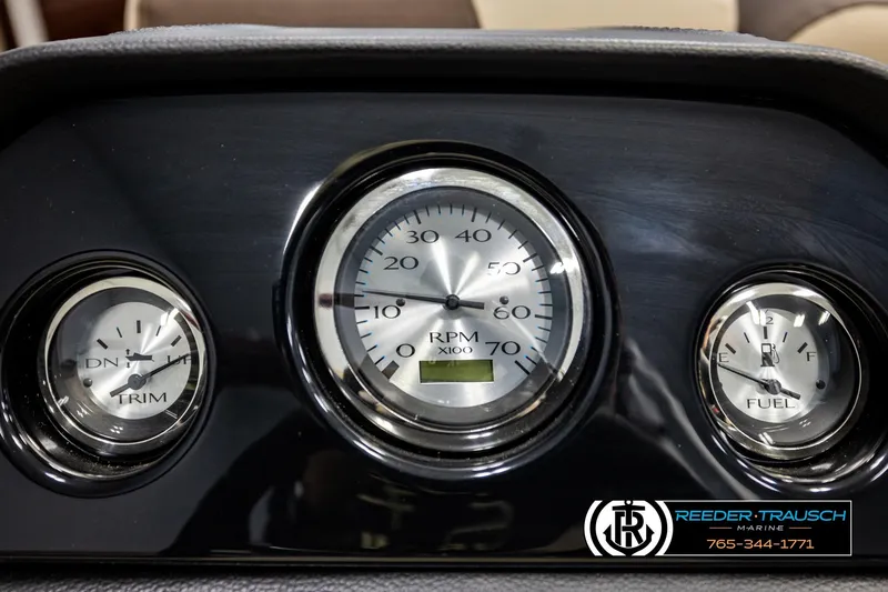 Slide: The Image of Dashboard of 2026 Bennington SSBSF boat with RPM, trim, and fuel gauges. - 32