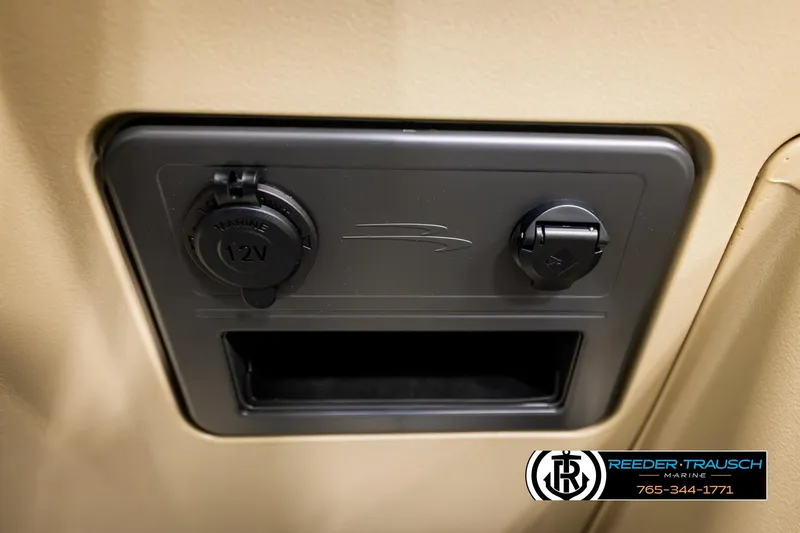 Slide: The Image of 2026 Bennington SSBSF marine 12V power outlet and USB port panel. - 35