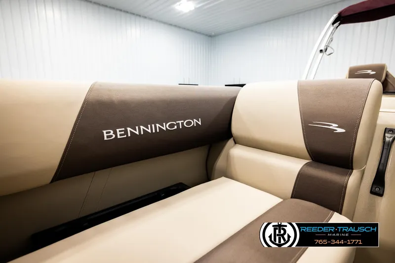 Slide: The Image of 2026 Bennington SSBSF boat interior with beige and brown seating. - 39