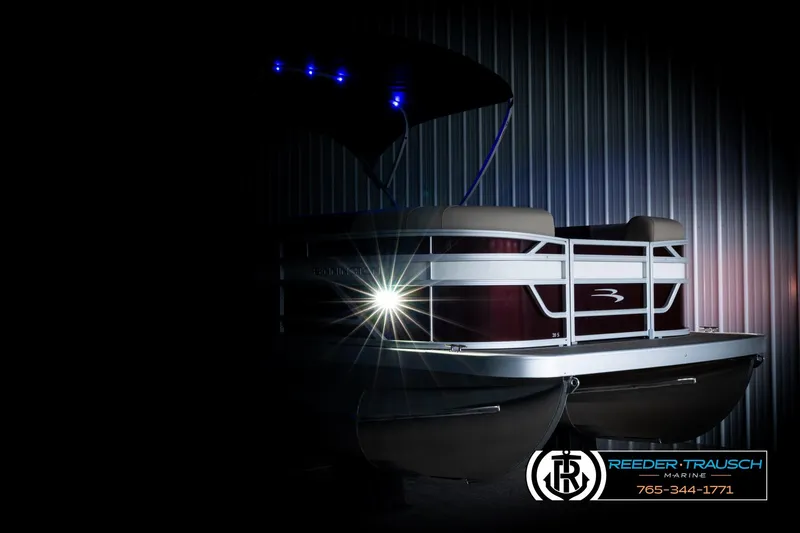 Slide: The Image of 2026 Bennington SSBSF pontoon boat with illuminated deck and sleek design. - 4