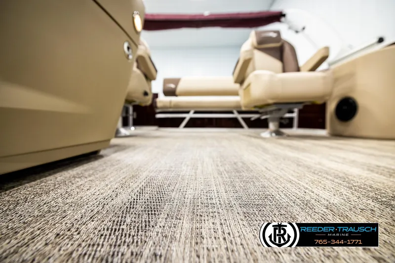Slide: The Image of 2026 Bennington SSBSF boat interior with beige seating and textured flooring. - 45