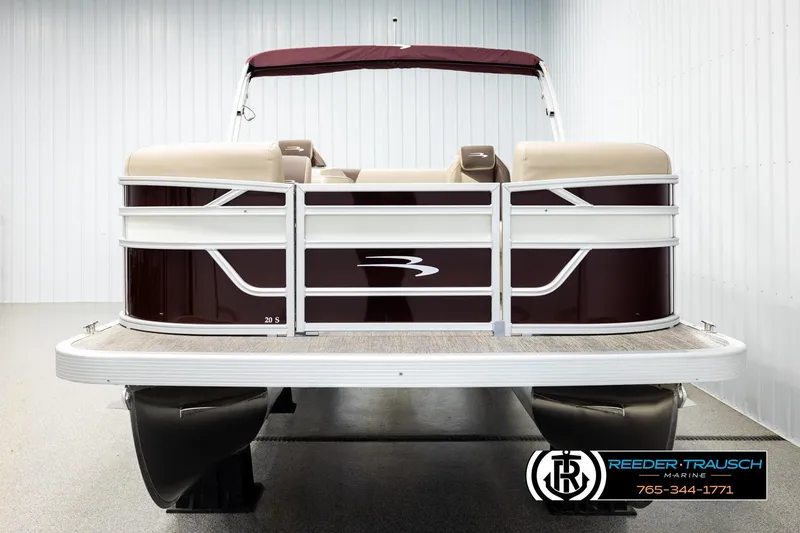 Slide: The Image of 2026 Bennington SSBSF pontoon boat with maroon and beige design in showroom. - 8