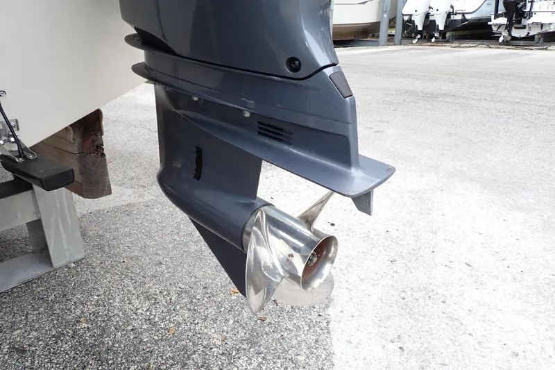 Slide: The Image of Outboard motor of 2016 Grady-White Freedom 275 boat on a trailer. - 100