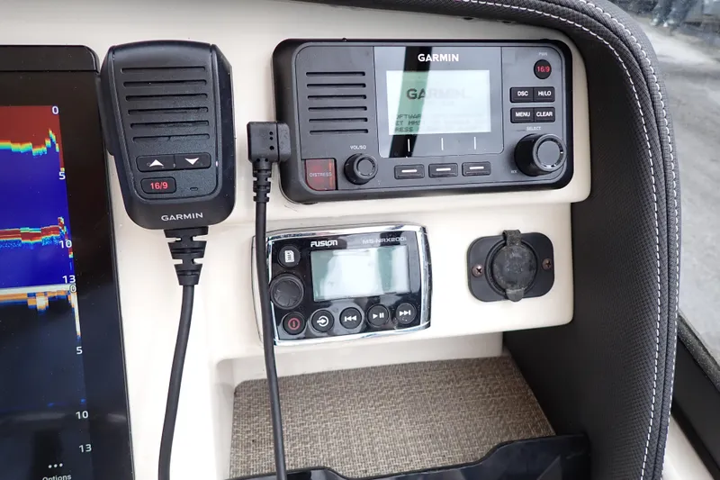 Slide: The Image of 2016 Grady-White Freedom 275 boat dashboard with Garmin and Fusion electronics. - 12