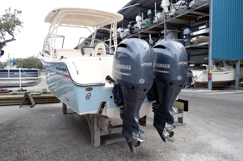 Slide: The Image of 2016 Grady-White Freedom 275 boat with twin Yamaha 200 engines in storage. - 2